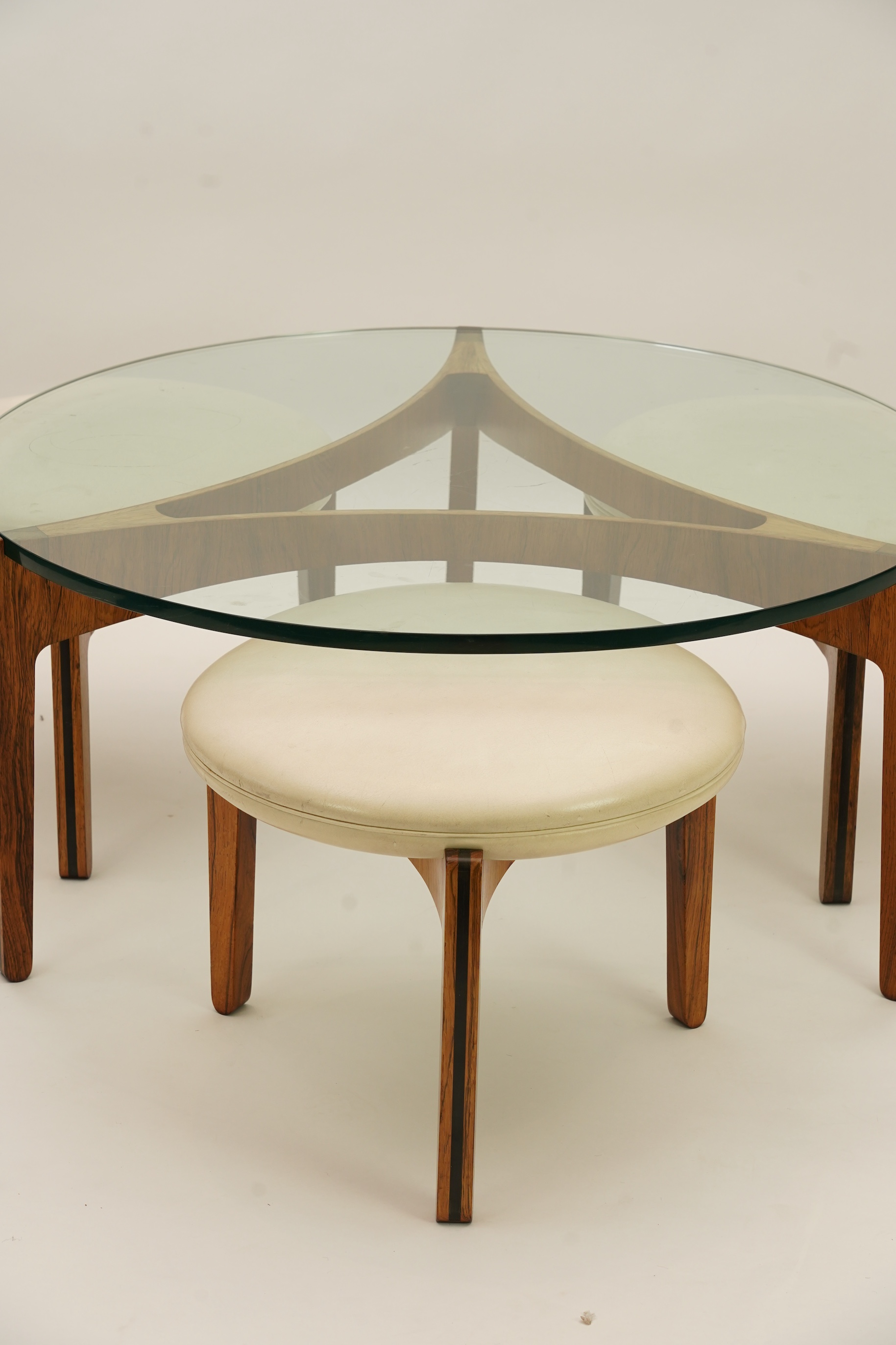 Sven Ellekaer (Danish, 1926-1984) for Christian Linneberg Møbelfabrik: A coffee table and three nesting stools ensuite